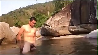Asian boy naked shower in river
